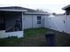 Backyard with patio, partial view of the house and surrounding greenery at 2304 W Rio Vista Ave, Tampa, FL 33603