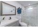 Modern bathroom with a new vanity and a luxurious glass-enclosed shower, providing an elegant design at 2304 W Rio Vista Ave, Tampa, FL 33603