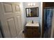 Bathroom features a modern vanity and a shower with a stylish curtain, creating a cozy and functional space at 2304 W Rio Vista Ave, Tampa, FL 33603