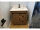 Bathroom featuring a wooden cabinet with drawers, white countertops, and silver fixtures at 2304 W Rio Vista Ave, Tampa, FL 33603