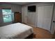 Bedroom features a closet and large window, enhancing the room's functionality and comfort at 2304 W Rio Vista Ave, Tampa, FL 33603