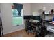 Bedroom has a large window and set up as an office with multiple monitors, providing a bright and productive workspace at 2304 W Rio Vista Ave, Tampa, FL 33603