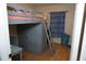 Unique bedroom with a lofted bed, built-in wardrobe, and a dedicated workspace at 2304 W Rio Vista Ave, Tampa, FL 33603