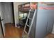 Bedroom features a stylish loft bed with a built in desk, adding functionality and space-saving design to the room at 2304 W Rio Vista Ave, Tampa, FL 33603