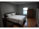 Bedroom features a large window and closet, filling the space with natural light for a cozy atmosphere at 2304 W Rio Vista Ave, Tampa, FL 33603