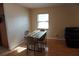 Sunlit dining area with wood floors and seating for four at 2304 W Rio Vista Ave, Tampa, FL 33603