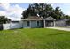 Charming single-story home featuring a well-maintained lawn and a screened front porch at 2304 W Rio Vista Ave, Tampa, FL 33603