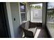 Close-up of front porch with tiled floors and outdoor seating at 2304 W Rio Vista Ave, Tampa, FL 33603