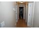 Inviting hallway with wood floors, neutral walls, and multiple doorways leading to various rooms at 2304 W Rio Vista Ave, Tampa, FL 33603