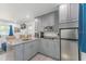 The kitchen has granite countertops, stainless steel appliances, and bar seating, perfect for entertaining at 2304 W Rio Vista Ave, Tampa, FL 33603