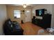 Inviting living room featuring wood flooring, ceiling fan, and media center at 2304 W Rio Vista Ave, Tampa, FL 33603