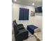 Cozy living room with comfortable seating and a mounted television offers a relaxing space at 2304 W Rio Vista Ave, Tampa, FL 33603