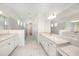 Large bathroom with marble flooring, a glass shower, and a double vanity with plenty of counterspace at 2492 Overfalls Pl, Wesley Chapel, FL 33543
