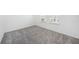 Neutral bedroom with plush carpet, bright light, and ample space at 2492 Overfalls Pl, Wesley Chapel, FL 33543
