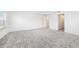 Large carpeted bedroom with natural light from the windows throughout the room at 2492 Overfalls Pl, Wesley Chapel, FL 33543
