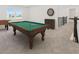 Upstairs game room with a pool table, foosball, dart board, and carpet flooring at 2492 Overfalls Pl, Wesley Chapel, FL 33543
