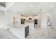 Modern kitchen with stainless steel appliances, double islands, and marble floors at 2492 Overfalls Pl, Wesley Chapel, FL 33543