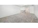 Upstairs loft area boasts neutral walls and plush carpeting with staircase and hallway access at 2492 Overfalls Pl, Wesley Chapel, FL 33543