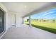 The covered patio has great views of the water and backyard at 2492 Overfalls Pl, Wesley Chapel, FL 33543