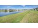 Scenic pond surrounded by lush greenery, offering a tranquil and picturesque view at 2492 Overfalls Pl, Wesley Chapel, FL 33543