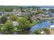 Waterfront homes with access to a channel, blue skies and mature landscaping at 33 Cypress Dr, Palm Harbor, FL 34684