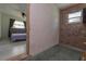 View of the bedroom connected to a basement space that needs finishing at 33 Cypress Dr, Palm Harbor, FL 34684