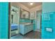 A vintage tiled bathroom connects to the neighboring bedroom at 33 Cypress Dr, Palm Harbor, FL 34684