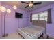 Charming bedroom with unique lighting, and a custom headboard at 33 Cypress Dr, Palm Harbor, FL 34684