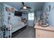 Unique bedroom with hanging hammock chair, mounted TV, and ample decor at 33 Cypress Dr, Palm Harbor, FL 34684