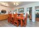 Bright dining room with wooden table and chairs and light hardwood style flooring at 33 Cypress Dr, Palm Harbor, FL 34684