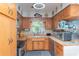 Charming kitchen boasting wood countertops, wooden cabinetry, and stainless steel appliances at 33 Cypress Dr, Palm Harbor, FL 34684