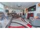 Basement living room with reclining furniture, a fireplace, and ample entertaining space at 33 Cypress Dr, Palm Harbor, FL 34684