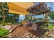 Relaxing patio with outdoor seating and shade, overlooking canal for a peaceful retreat at 33 Cypress Dr, Palm Harbor, FL 34684