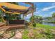 Charming patio with swing and canal views, offering a serene spot for relaxation and waterfront living at 33 Cypress Dr, Palm Harbor, FL 34684