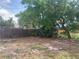 Spacious backyard featuring mature trees and partial fencing at 3927 Huntington Ne St, St Petersburg, FL 33703
