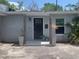 Inviting entrance featuring a classic black door and decorative planters at 3927 Huntington Ne St, St Petersburg, FL 33703