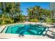 Outdoor hot tub with clear water, surrounded by tropical foliage and a sunny sky at 400 Island Way # 1606, Clearwater Beach, FL 33767