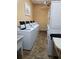 Convenient laundry room with multiple washers and dryers for residents' use at 400 Island Way # 1606, Clearwater Beach, FL 33767