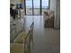 Spacious living room with tile flooring and large windows showcasing the city skyline at 400 Island Way # 1606, Clearwater Beach, FL 33767