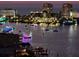 Stunning night view of decorated boats on the water with city lights in the background at 400 Island Way # 1606, Clearwater Beach, FL 33767