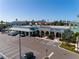 Commercial building with ample parking spaces and covered walkways at 400 Island Way # 1606, Clearwater Beach, FL 33767