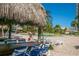 Inviting pool area with tiki umbrellas and lounge chairs for residents at 400 Island Way # 1606, Clearwater Beach, FL 33767