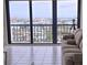 Sliding doors offer a panoramic water view from the living space at 400 Island Way # 1606, Clearwater Beach, FL 33767