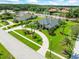 Beautiful home with circular drive, mature landscaping, and tranquil water views in a quiet neighborhood at 4521 Cheval Blvd, Lutz, FL 33558