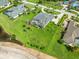Gorgeous home features screened-in pool, manicured lawn, and tropical palm trees, offering a private oasis at 4521 Cheval Blvd, Lutz, FL 33558