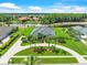 Stunning home boasts lush landscaping, circular driveway, and serene water views in a desirable community at 4521 Cheval Blvd, Lutz, FL 33558