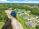 Aerial shot highlighting the property, its mature landscaping, and proximity to serene water features at 4521 Cheval Blvd, Lutz, FL 33558