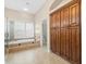 This is a bathroom with a walk-in shower, a soaking tub, and wooden cabinets at 4521 Cheval Blvd, Lutz, FL 33558