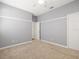 Neutral-toned bedroom with a ceiling fan and closet at 4521 Cheval Blvd, Lutz, FL 33558