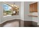Dining area boasts dark wood floors and a stunning view of the screened pool area at 4521 Cheval Blvd, Lutz, FL 33558